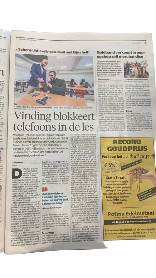 Krantenpagina met het artikel Vinding blokkeert telefoons in de les